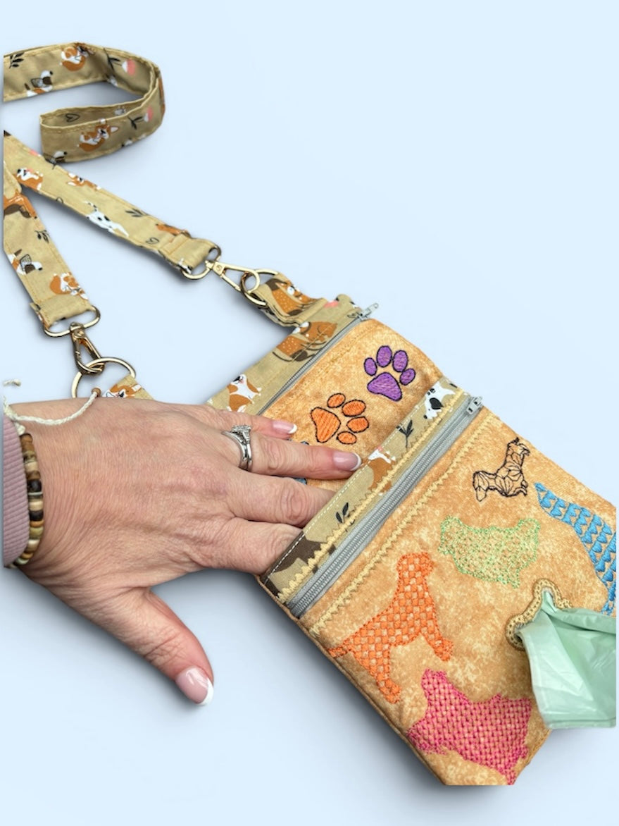 Dog walking bag with poop bag dispenser