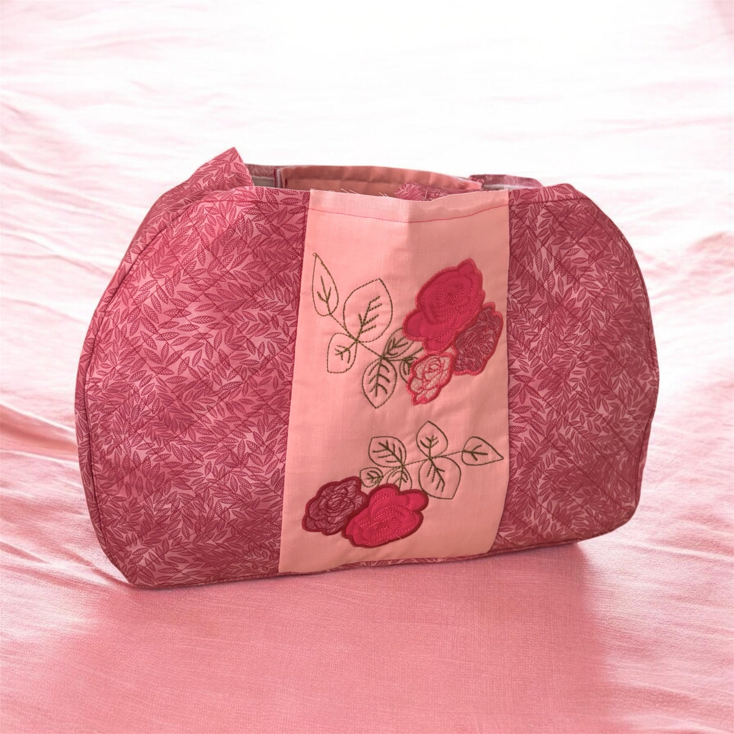 Pink embroidered weekend bag
