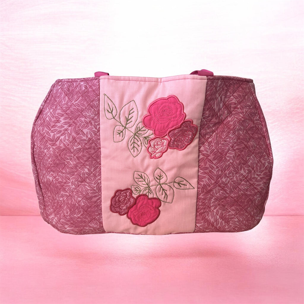 Pink embroidered weekend bag