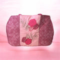 Pink embroidered weekend bag